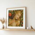 Framed artwork of a woman with flowers on a shelf with decorative items. Sleeping Beauty in Rose Garden